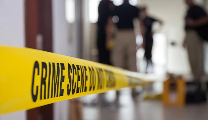 Yellow police tape sealing off an accident scene for investigation