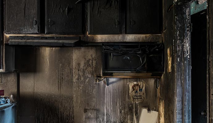Smoke and soot damaged kitchen interior