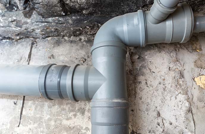 sewer pipes in basement